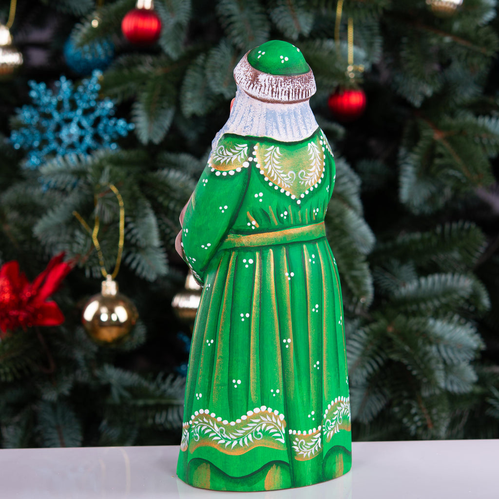 Hand carved Santa wooden figurine 8.7 inch, holding dog, green coat