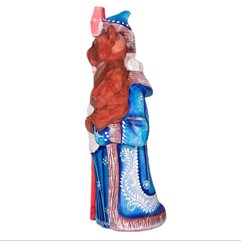 Old World Santa figurine 8.5 inch, carved wood, blue coat, holding bear, mantel display