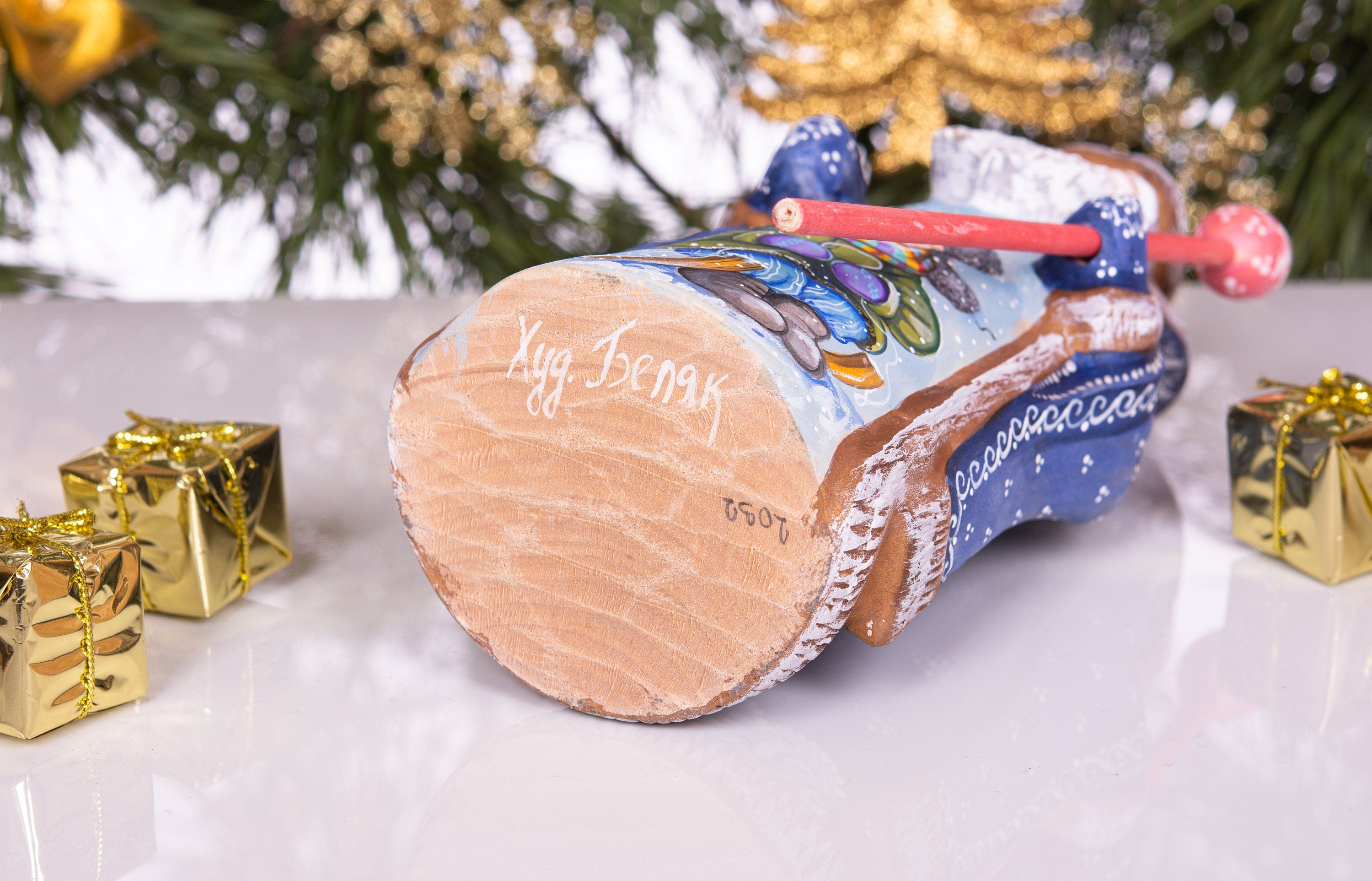 Hand carved and painted Santa 9 inch wooden figurine, snowy sledding scene, centerpiece
