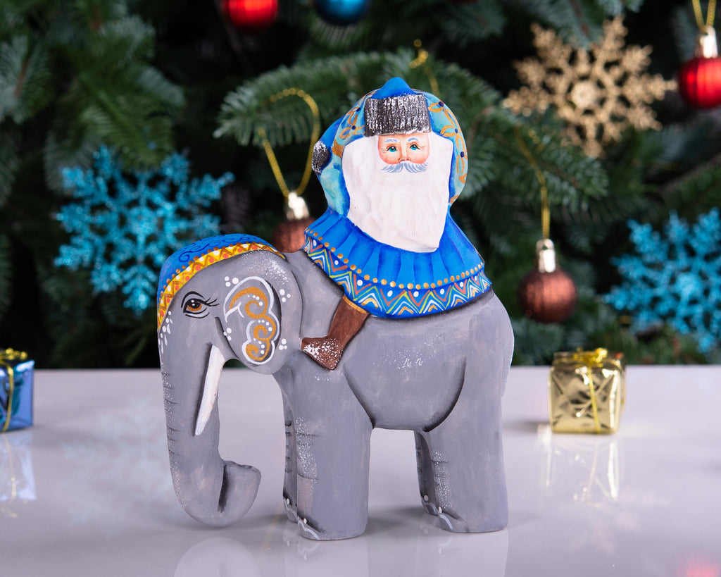 Hand‑carved Father Christmas — riding an elephant, 6.3″